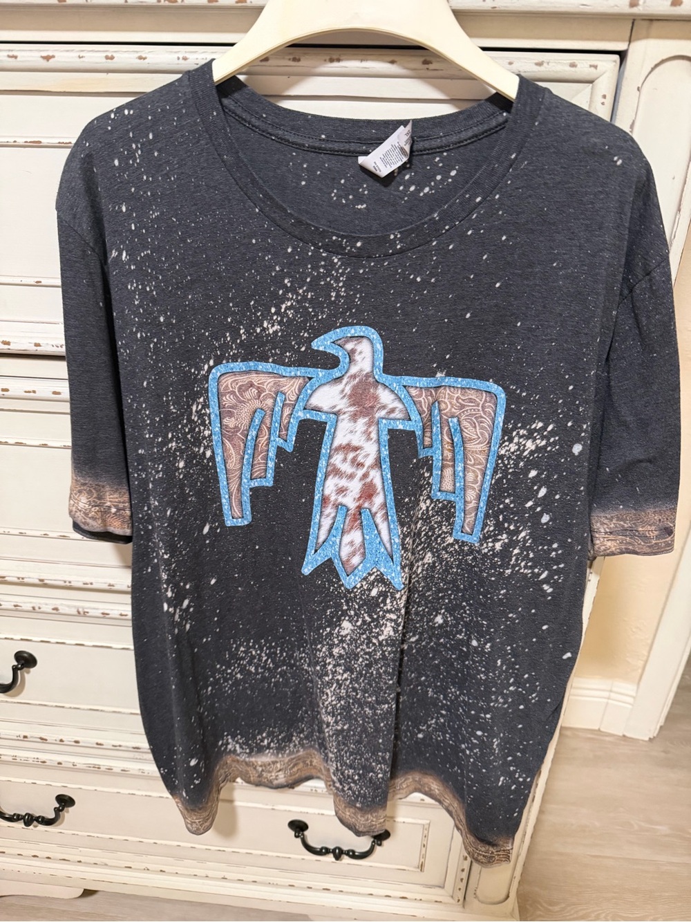 Women’s Bella Canvas Black Tee with Blue-Outlined Thunderbird Graphic